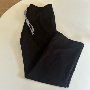 Medium petite black figs pants, lightly worn.